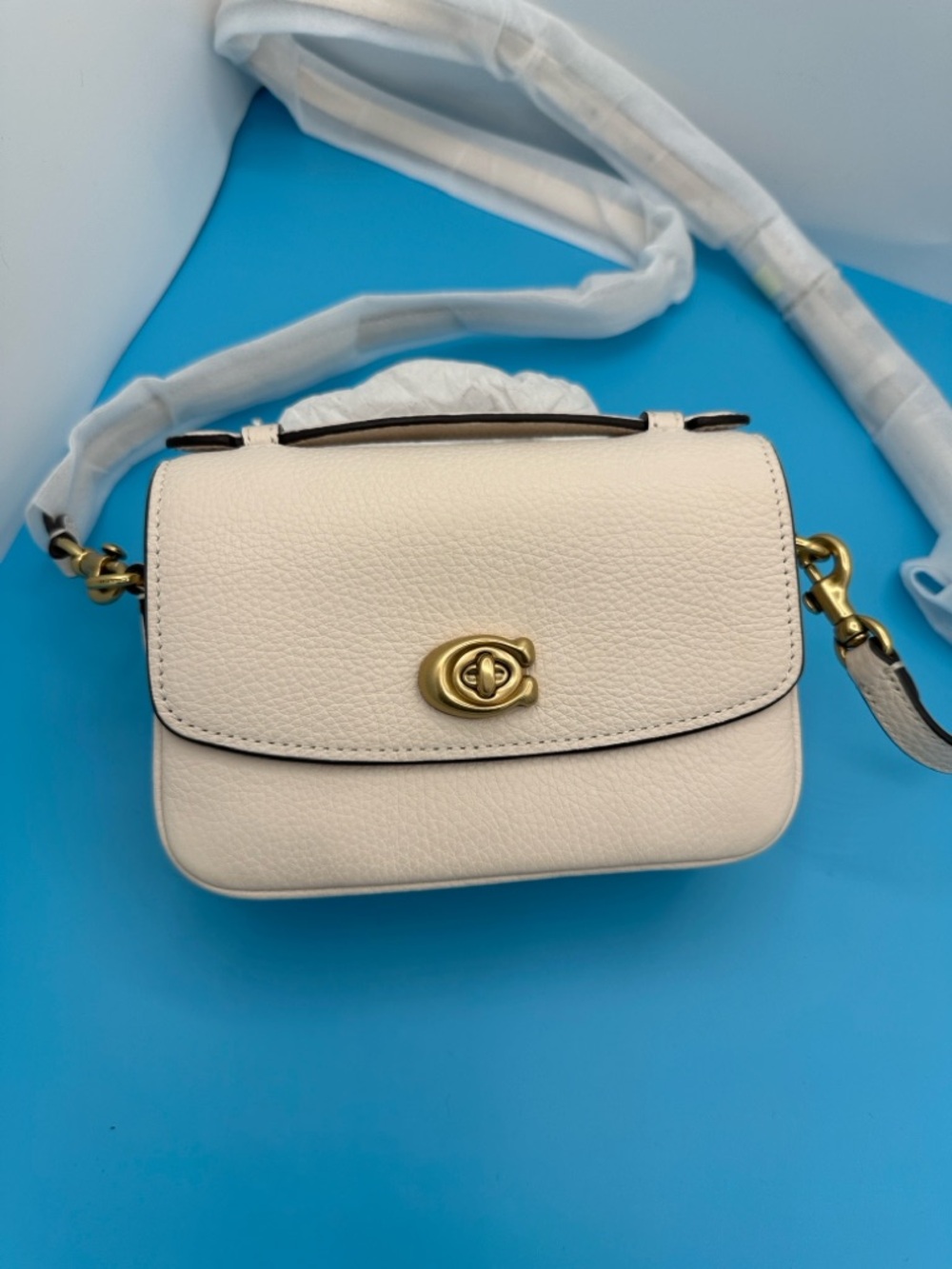 New! Coach Cassie Crossbody bag 19.  pebble leather in cream. Brand New!